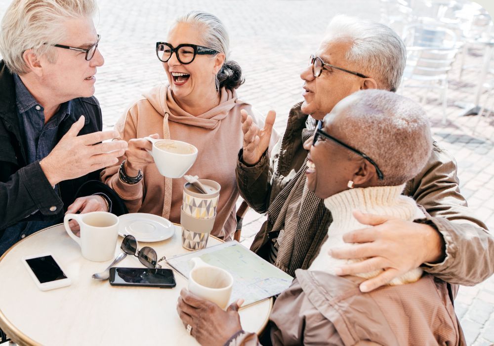 Older people having coffee with friends