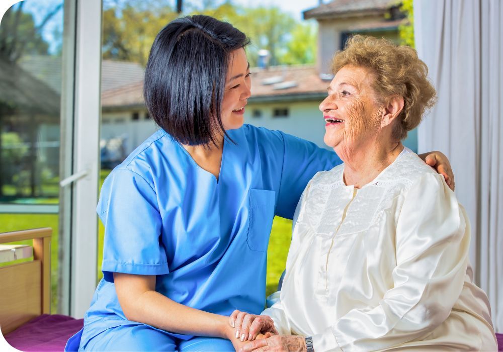 a happy in home worker and a happy patient sitting outside