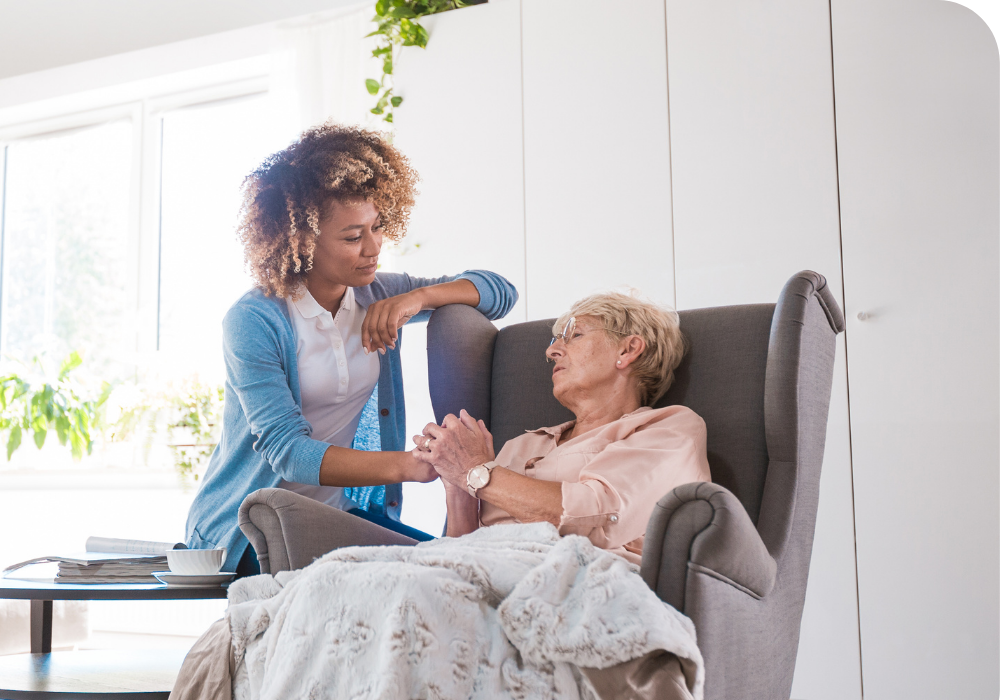 Home care woman holding hands with elderly woman