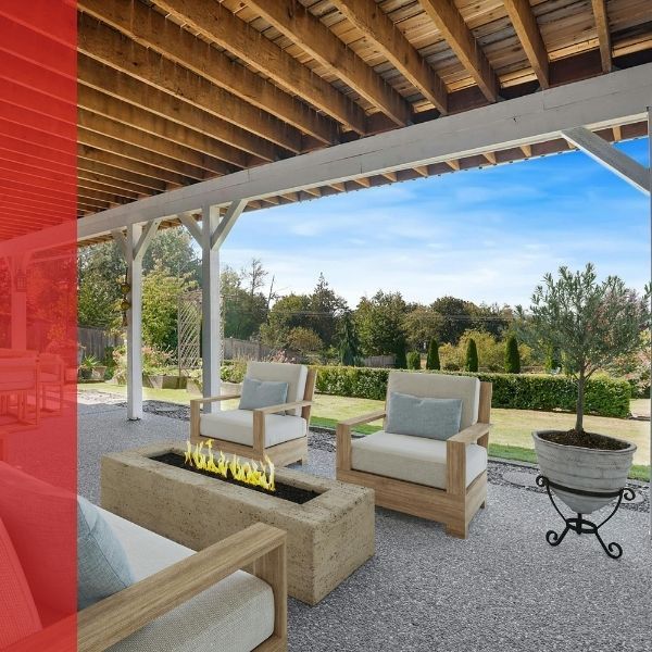 Concrete patio with dining set and fireplace in a backyard