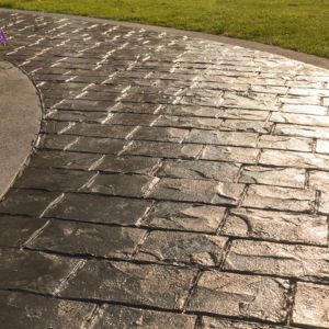 Driveway to a home with fresh stamped and brushed concrete