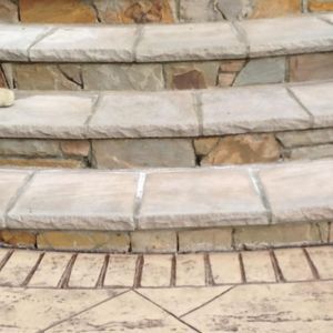 Faux natural stone steps up to home