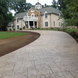 Home with long concrete driveway
