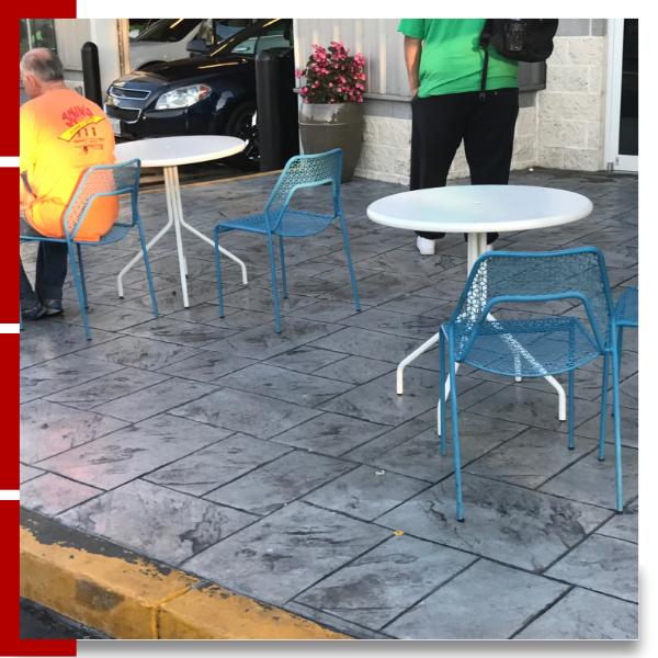 Commercial patio with stamped concrete and tables