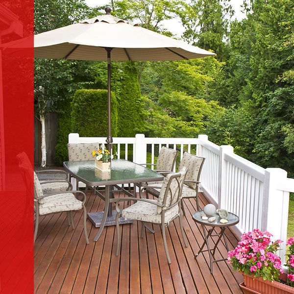 Wood deck on home with dining set