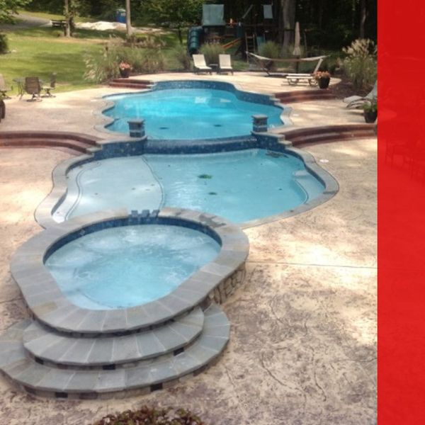 Backyard pool with brushed concrete pool deck