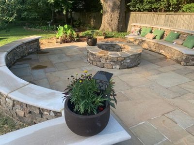 Backyard seating area with concrete patio and fire pit Backyard seating area with concrete patio and fire pit