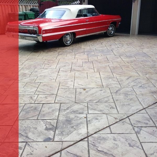 Stamped concrete driveway with car parked