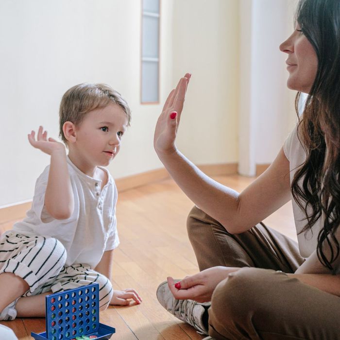 mom and child high fiving