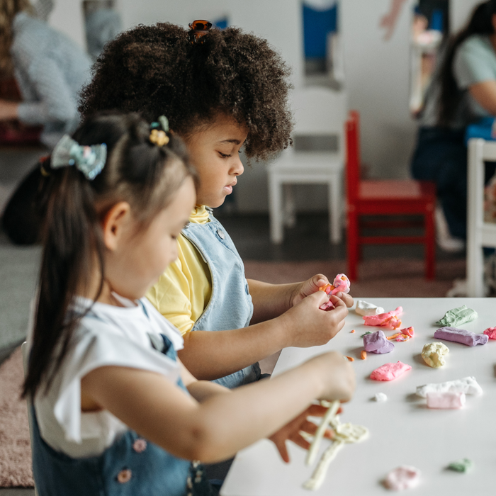 Children playing with play dough