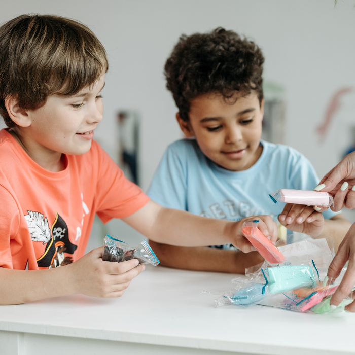 Two children playing with blocks