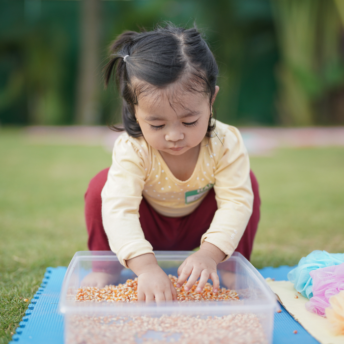 little girl doing a craft