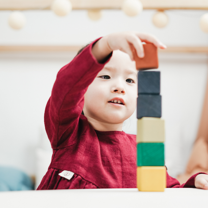 Child stacking blocks