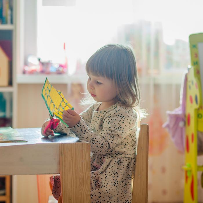 A child cutting out something