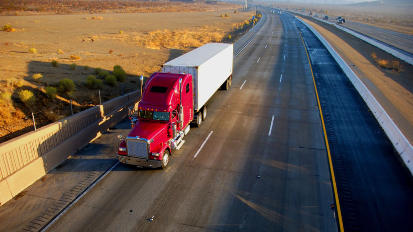 red semi truck on road red semi truck on road