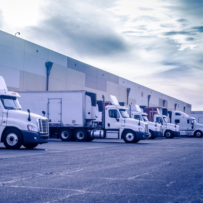 row of trucks at shipping dock