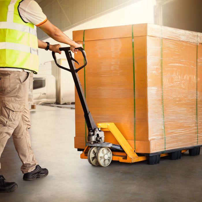 A person moving a pallet