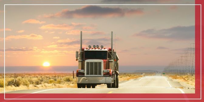 Semi truck driving through desert