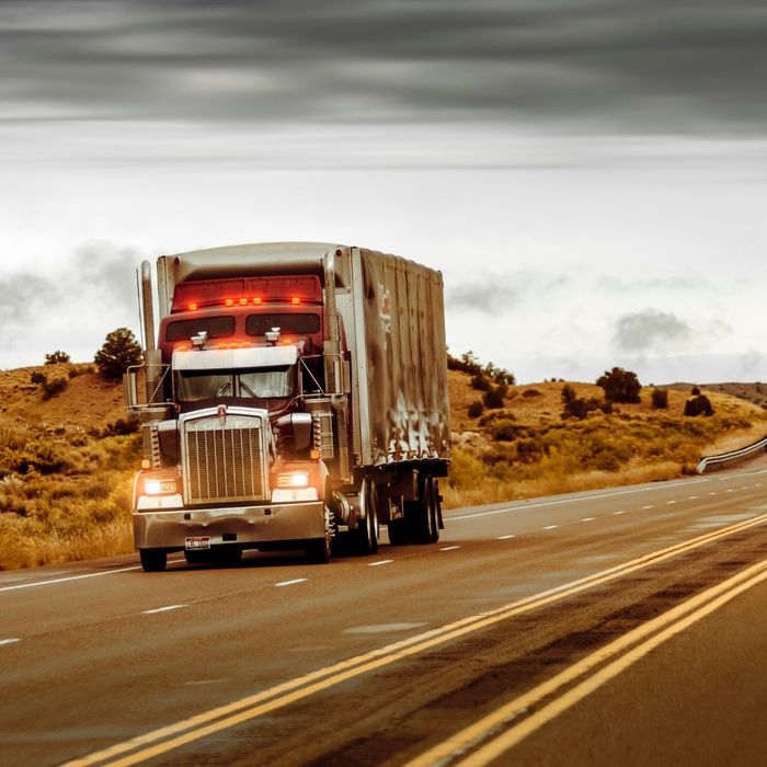 semi-truck driving on highway semi-truck driving on highway
