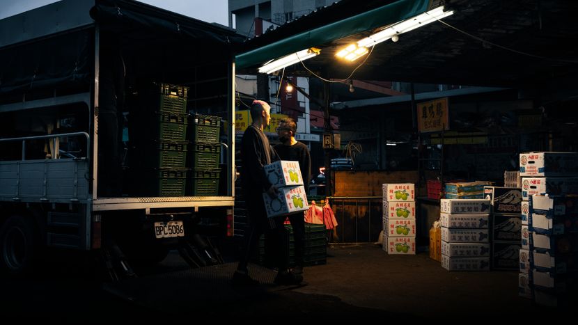 Delivery men with their truck at night