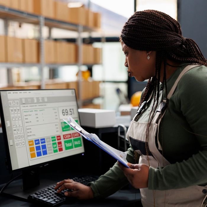 A person looking over data on a computer