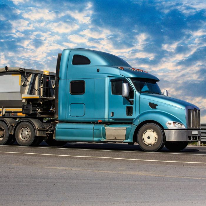 A baby blue semi truck