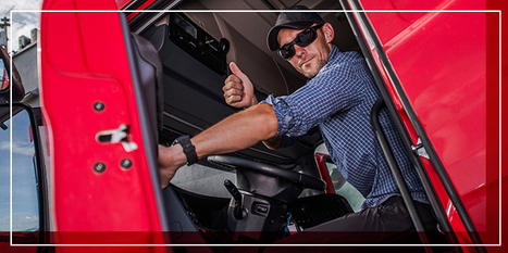 Truck driver giving the thumbs up from his truck