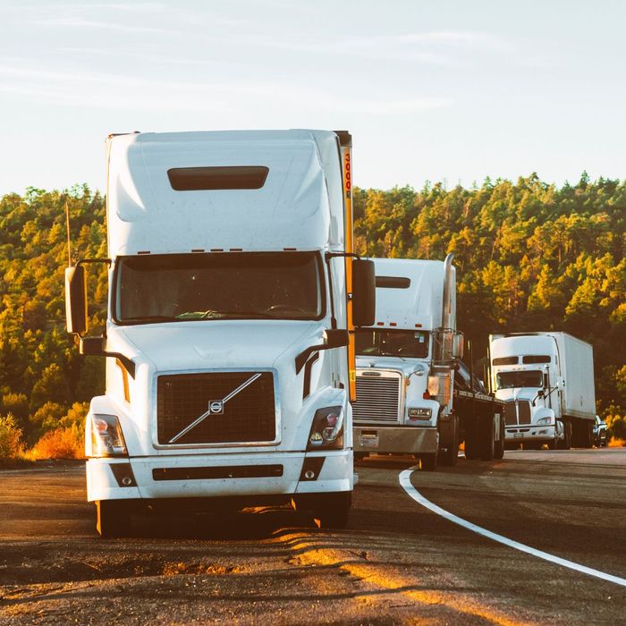 line of semi-trucks line of semi-trucks