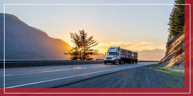 Semi truck driving on a road alone