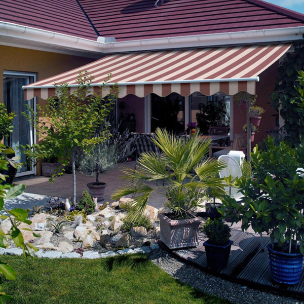 retractable red/white striped awning with scalloped edge. tidy landscaping