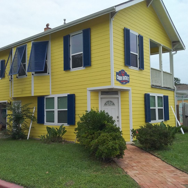 Blue shutters on a yellow home