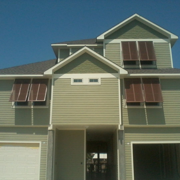 red shutters on a tan home