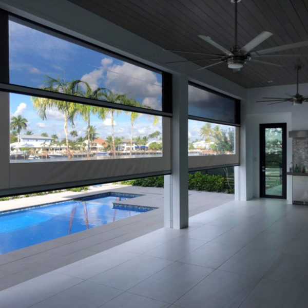 retractable screens, ceiling fans in porch/sunroom by pool