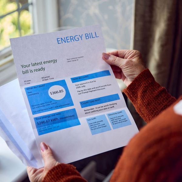 woman holding high energy bill