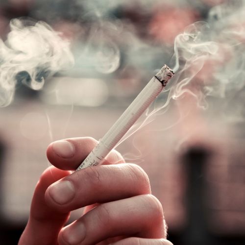 Someone Smoking a Cigarette Understanding Gum Disease2.jpg