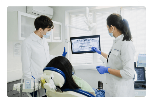 dentist looking at x-rays dentist looking at x-rays