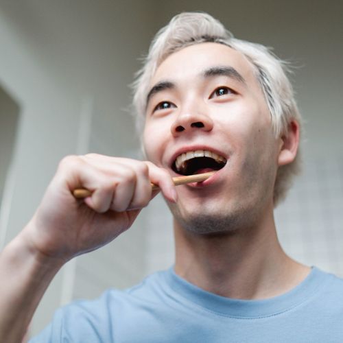 man brushing teeth man brushing teeth