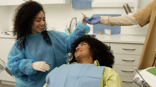 dentist talking to patient