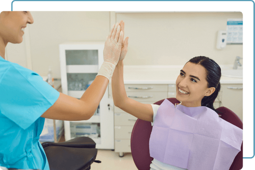 dentist high fiving patient dentist high fiving patient
