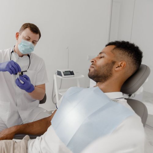 man talking with dentist man talking with dentist