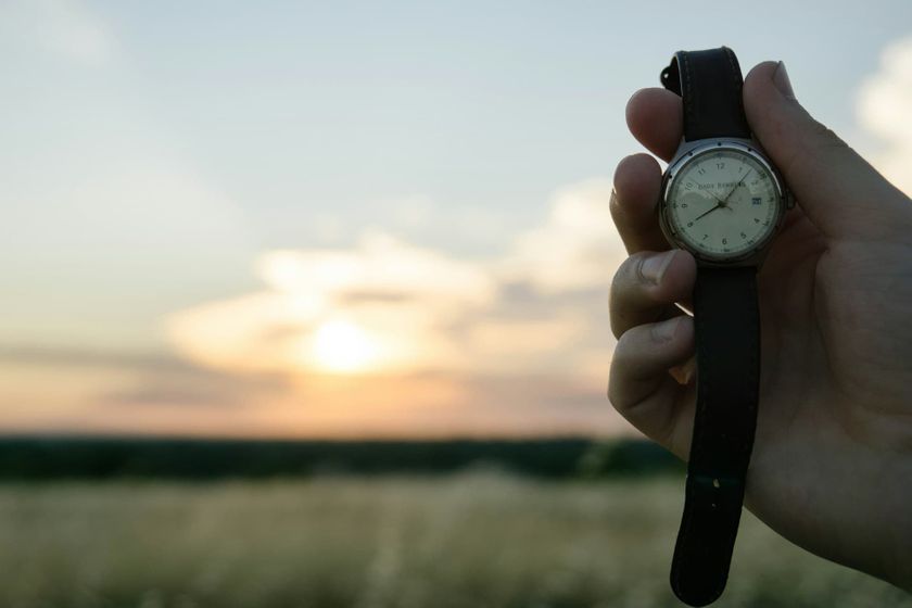 holding a watch on the beach.jpg