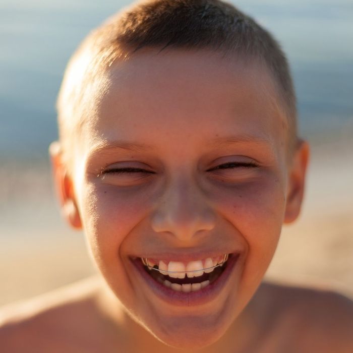 boy smiling, with crossbar style braces boy smiling, with crossbar style braces