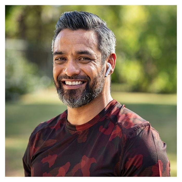 man smiling with aligned teeth