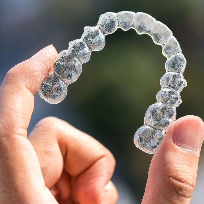 holding an Invisalign