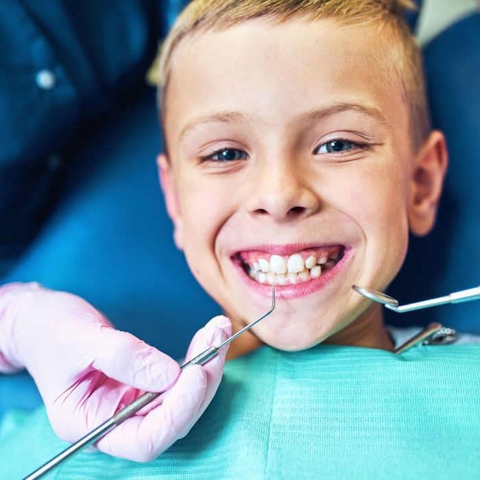 smiling child in dentist chair