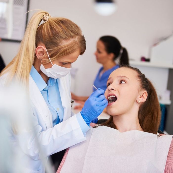 girl in orthodontist appointment girl in orthodontist appointment