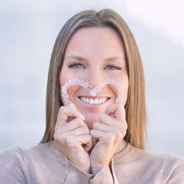 smiling woman with invisible braces