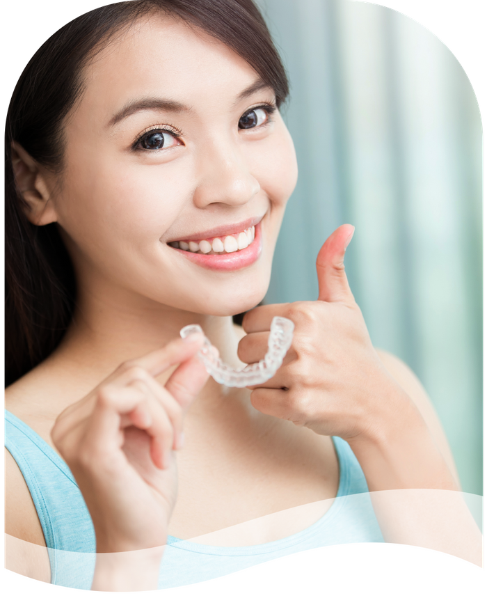 girl holding invisalign retainer