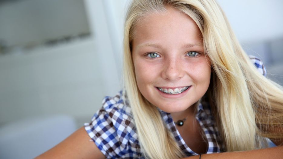 young woman smiling with braces