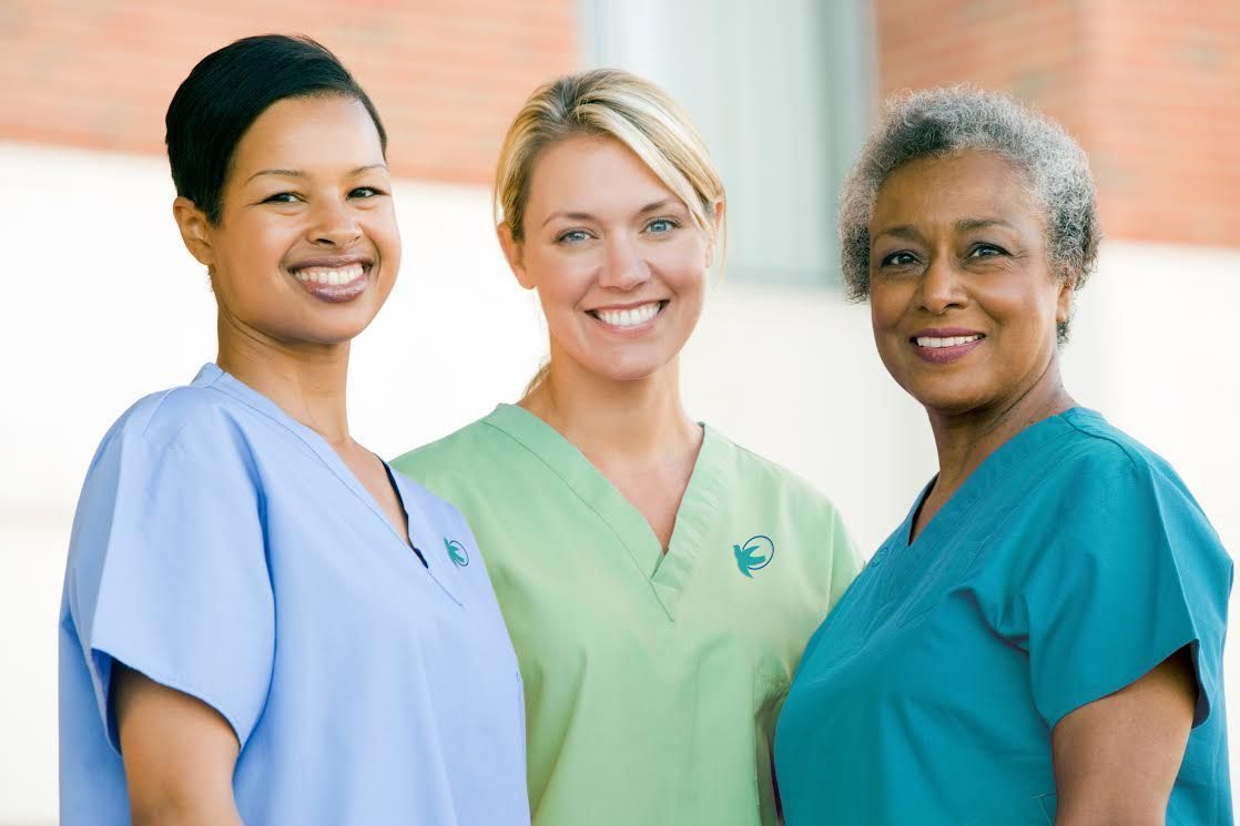 3 nurses smiling
